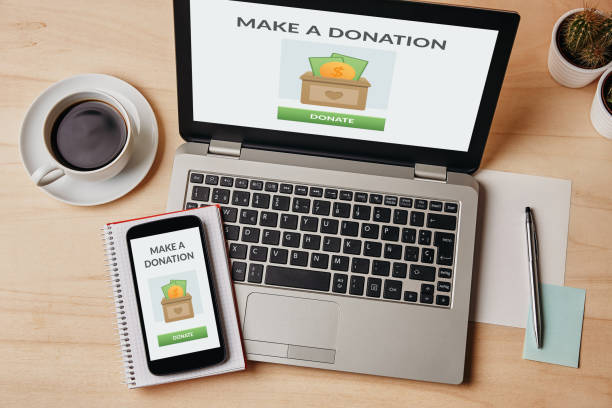 istock Donation concept on laptop and smartphone screen 1188446405