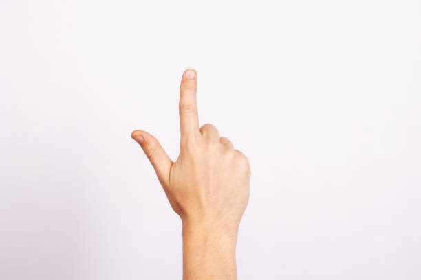 istock The man's hand isolated on white background. Gesture pointing, thumbs up, selection, pressing, indicating. 1188448940