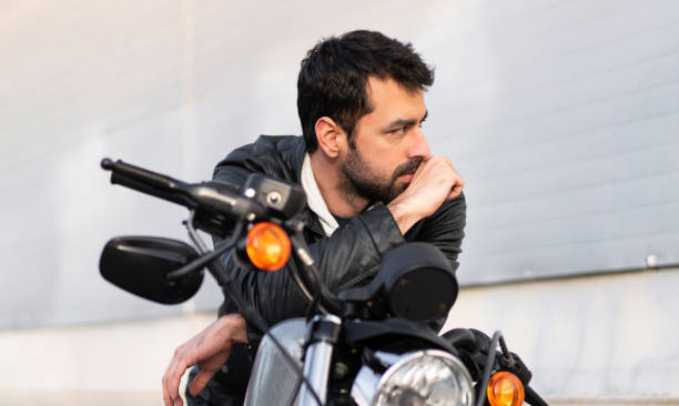 istock Young man on a motorbike 1188449268