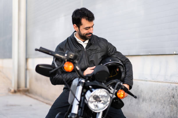 istock Young man on a motorbike 1188449429