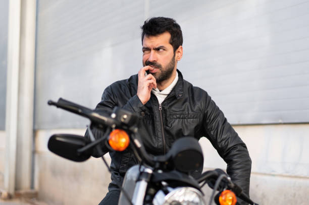 Frustrated young man on a motorbike