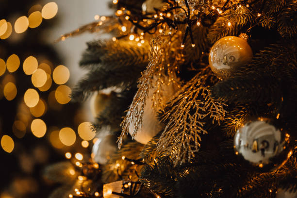 istock New Year Toys and Glowing Garland on Pine Tree 1188449593