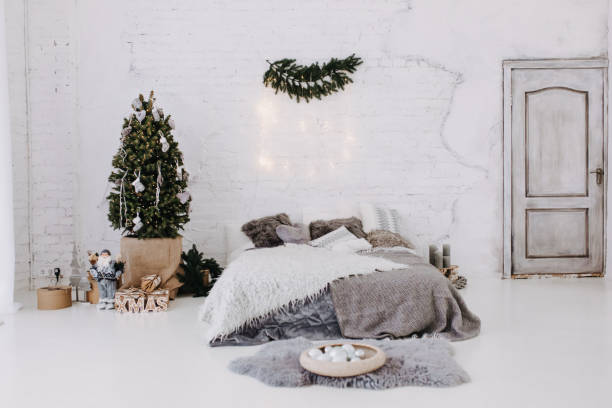 istock Bedroom Interior with Christmas Pine Tree and Gift 1188449612