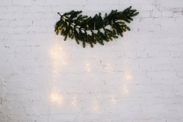 istock Garland Glowing Lamps Hanging from Tree Branch 1188449639