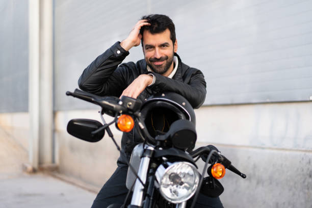 istock Young man on a motorbike 1188449706
