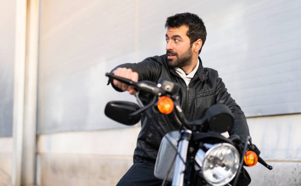 istock Young man on a motorbike 1188449728