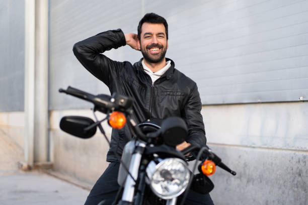 istock Young man on a motorbike 1188449804
