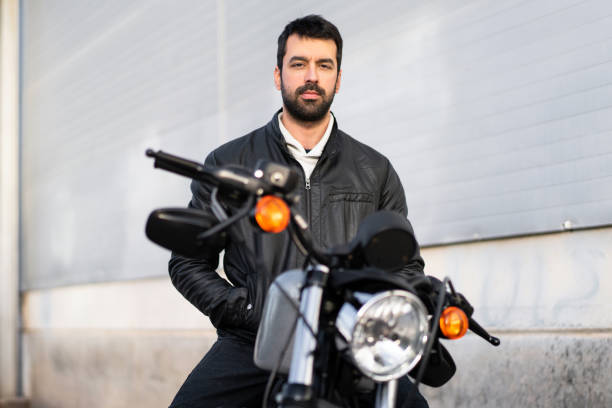istock Young man on a motorbike 1188450732
