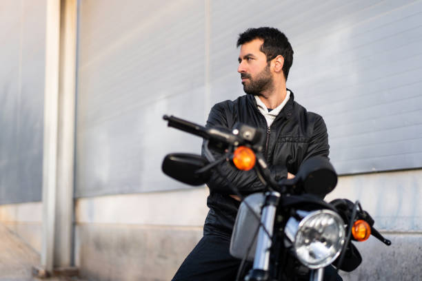 istock Young man on a motorbike 1188450814