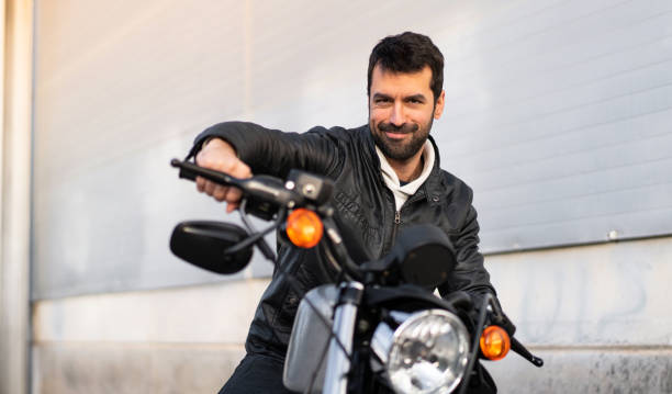 istock Happy young man on a motorbike 1188450918