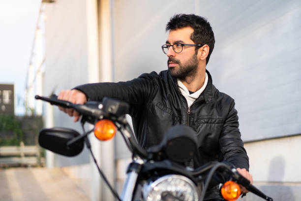 istock Young man on a motorbike 1188451082