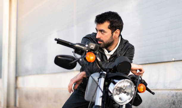 istock Young man on a motorbike 1188451148