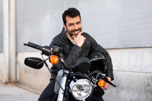istock Young man on a motorbike 1188451423