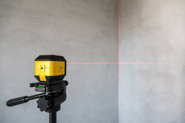 Laser level The laser level shows the verticality of the wall in the unfinished apartment. Construction Quality Assessment spirit level stock pictures, royalty-free photos & images