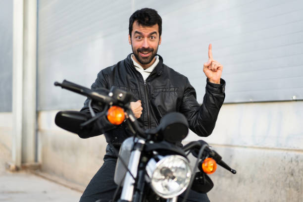 istock Young man on a motorbike 1188451465