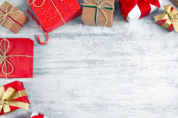 istock Christmas Gift Boxes on Wooden Table 1188452335