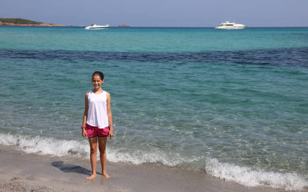 istock pretty little girl on seashore 1188452417
