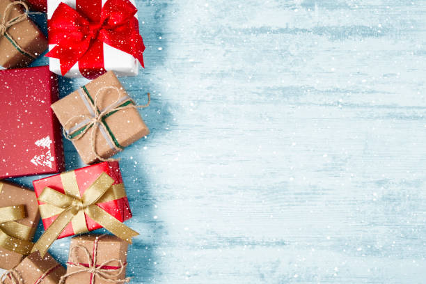 istock Christmas Gift Boxes on Wooden Table 1188452495
