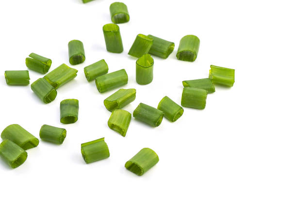 istock Chopped fresh green onions isolated on white background. 1188452507