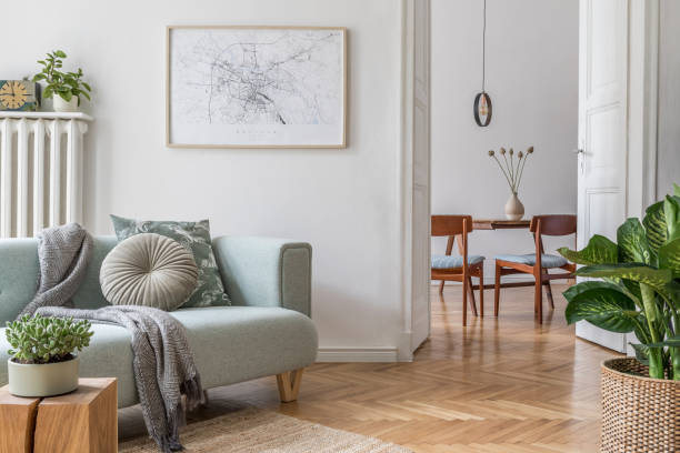 Stylish scandinavian living room with design mint sofa, furnitures, mock up poster map, plants and elegant personal accessories. Modern home decor. Open space with dining room. Template Ready to use. Modern scandinavian living room interior.Home decor. Interior design. Template. Ready to use. parquet floor photos stock pictures, royalty-free photos & images