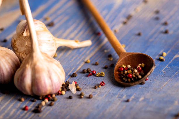 istock Garlic and pepper on an old wooden table 1188453715