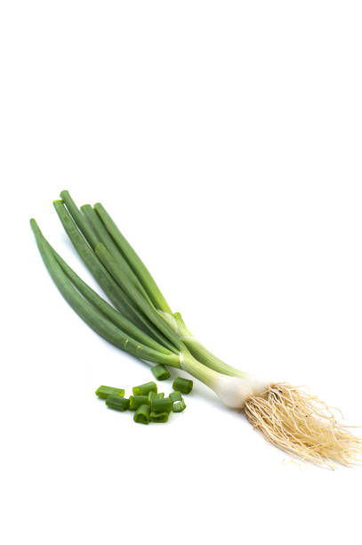 istock Fresh ripe green spring onions (shallots or scallions) on white background 1188453962