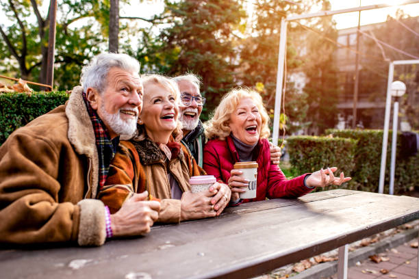 istock Happy seniors in the park take a break from walking 1188454089