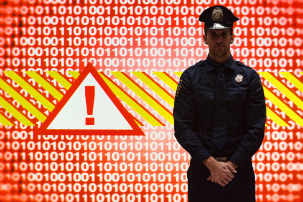 One man only / one person / waist up / front view of young men security staff / police force / computer programmer standing wearing hat / badge who is serious / confidence / concentration / horror who is coding and using computer / virtual reality / crime / binary code / computer network / computer software / data / encryption / identity / internet / password / privacy / problems / security / warning sign / warning triangle un hombre sólo / una persona / cintura para arriba / vista frontal del personal de seguridad de los hombres jóvenes / fuerza policial / programador de computadora sin estar de pie con sombrero / insignia que es serio / confianza / concentración / horror