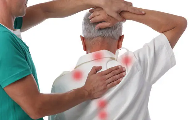 Photo of Chiropractic treatment. Shiatsu massage, Back Pain trigger points. Physiotherapy for senior male patient
