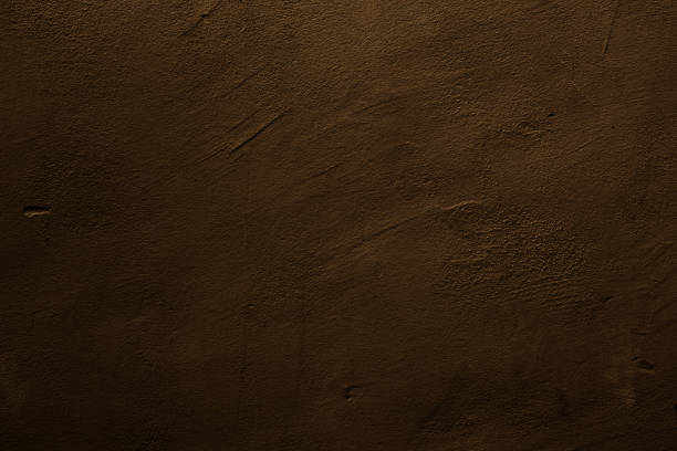 Abstract textured background in brown Brown colored background with textures of different shades of brown and bronze bronze paint stock pictures, royalty-free photos & images