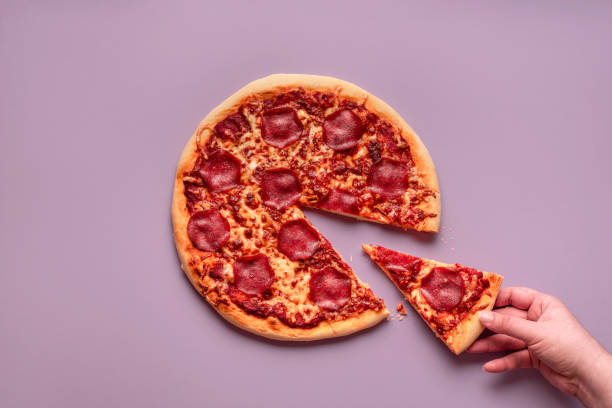 istock Taking pizza slice. Eating pizza pepperoni. Hot italian pizza 1188456854