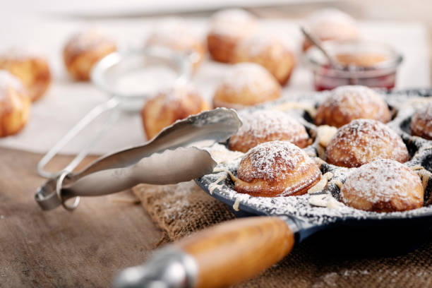 istock Traditional apple pancakes or Aebleskiver in danish. 1188456989