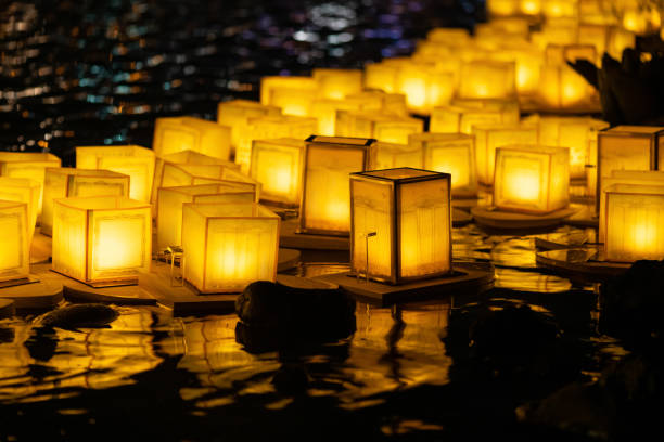 The Floating Lamp is a type of lamp that floats on the surface of the water. It is also known as a river lamp or lake lamp ,  lantern floating stock photo