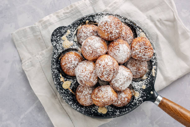 istock Traditional apple pancakes or Aebleskiver in danish. 1188457090