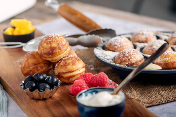 istock Traditional apple pancakes or Aebleskiver in danish. 1188457259