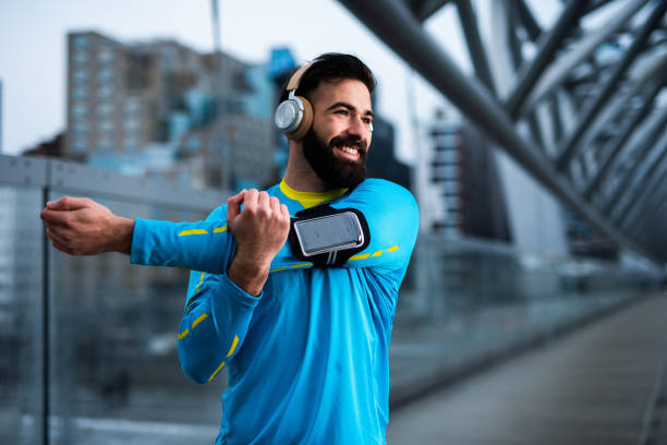 istock Athlete man stretching out on the bridge. 1188457340