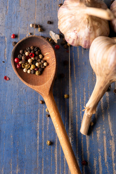 istock Garlic and pepper on an old wooden table 1188460098