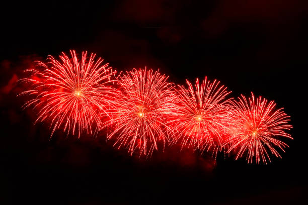 istock Amazing red fireworks on dark background 1188460534