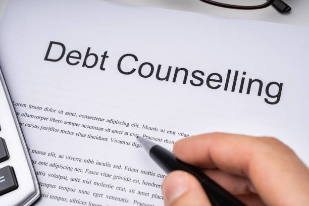 istock Person Signing Debt Counseling Form 1188462148