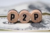 P2p Word On Wooden Blocks Over Dollar Bill