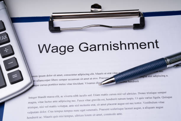 istock High Angle View Of Wage Garnishment Documents With Calculator An 1188462260