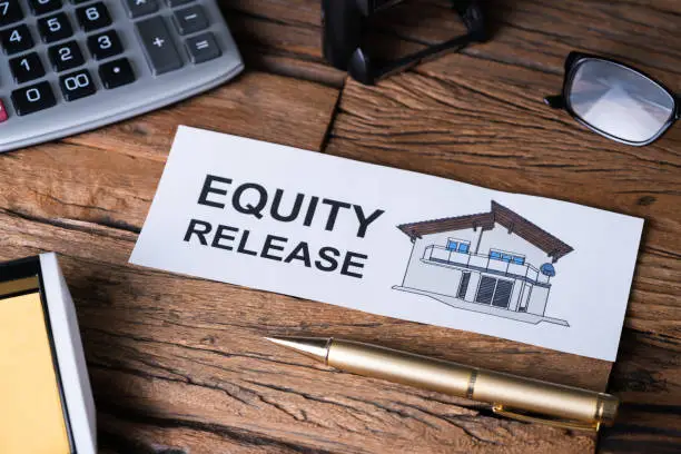 Photo of Equity Release Text On Paper Near Office Supplies