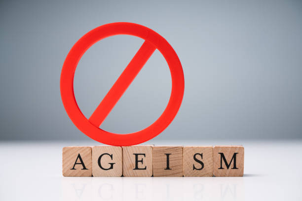 istock Ageism Text On Round Blocks Over White Desk 1188462681