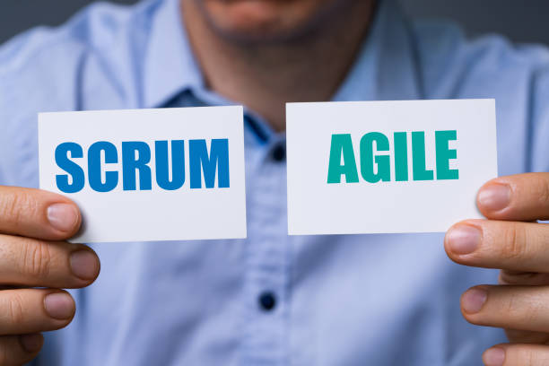 Man Showing Scrum And Agile Cards Man Showing Cards With Scrum And Agile Text scrum stock pictures, royalty-free photos & images