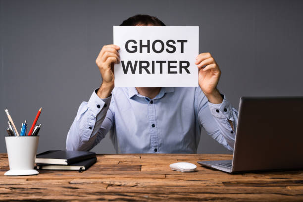 istock Businessman Hiding His Face Behind Card With Ghost Writer Text 1188462757