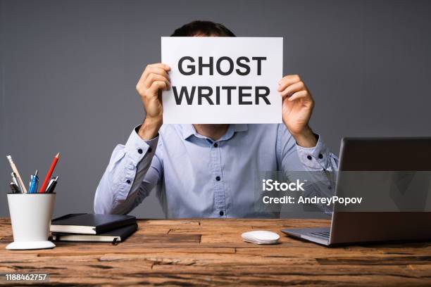 Businessman Hiding His Face Behind Card With Ghost Writer Text Stock Photo - Download Image Now