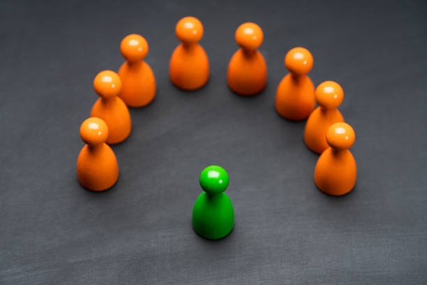 Concept of organization with wood figurines on black background