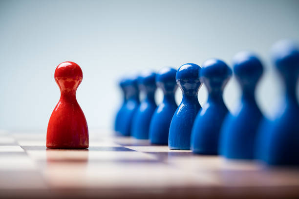 istock Red Pawns In Front Of Blue Pawns On Chessboard 1188462922