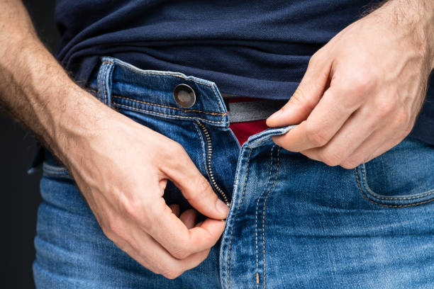 istock Man Unzipping His Blue Jeans 1188462962