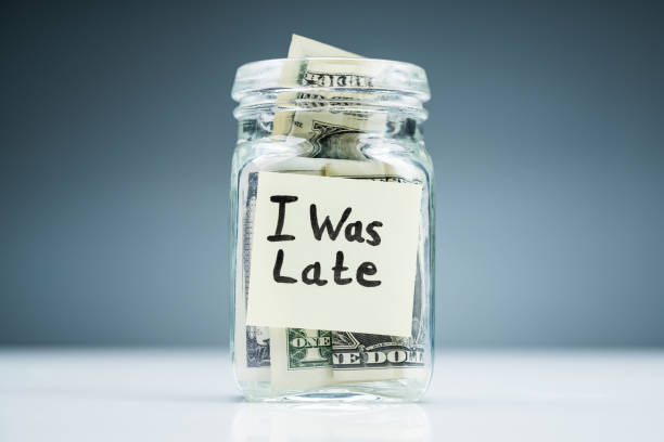 istock Dollar Banknotes In Jar With I Was Late Text 1188462967
